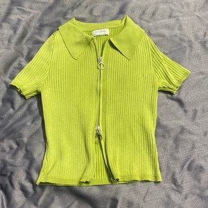 green kinda cropped zip up on down shirt